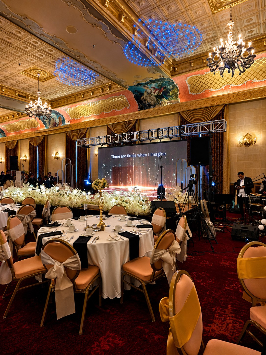 Corporate event production with LED wall, lighting and audio setup